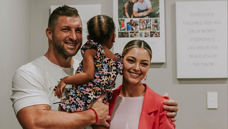 Tim and Demi-Leigh Tebow holding a baby