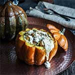 Stuffed pumpkin with bacon, leeks, and scallops