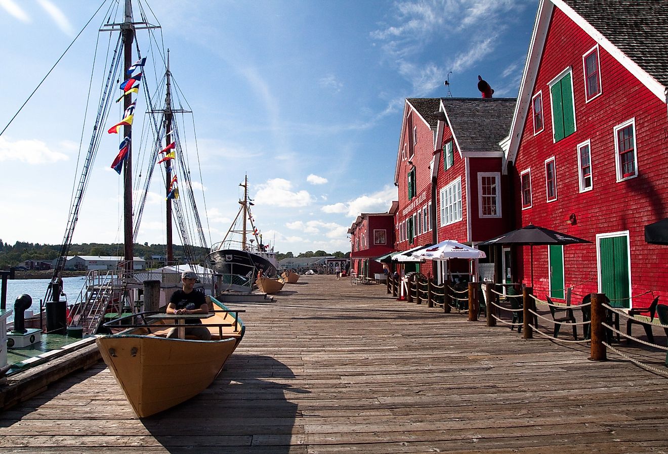 Colorful red buildings and boats in the harbor of Lunenburg, Nova Scotia.