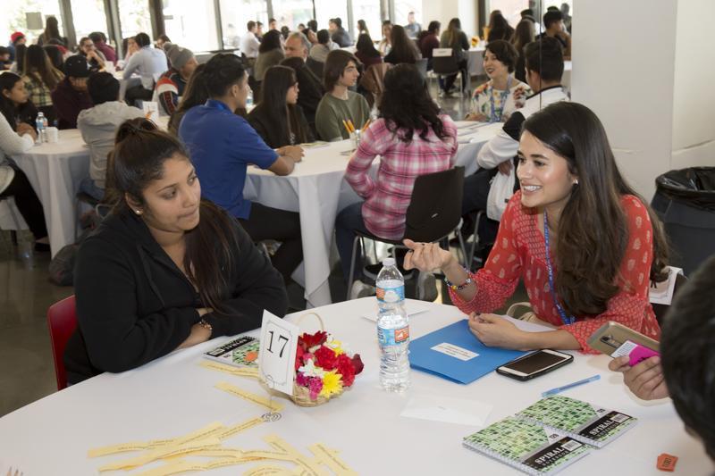 people talking at a table