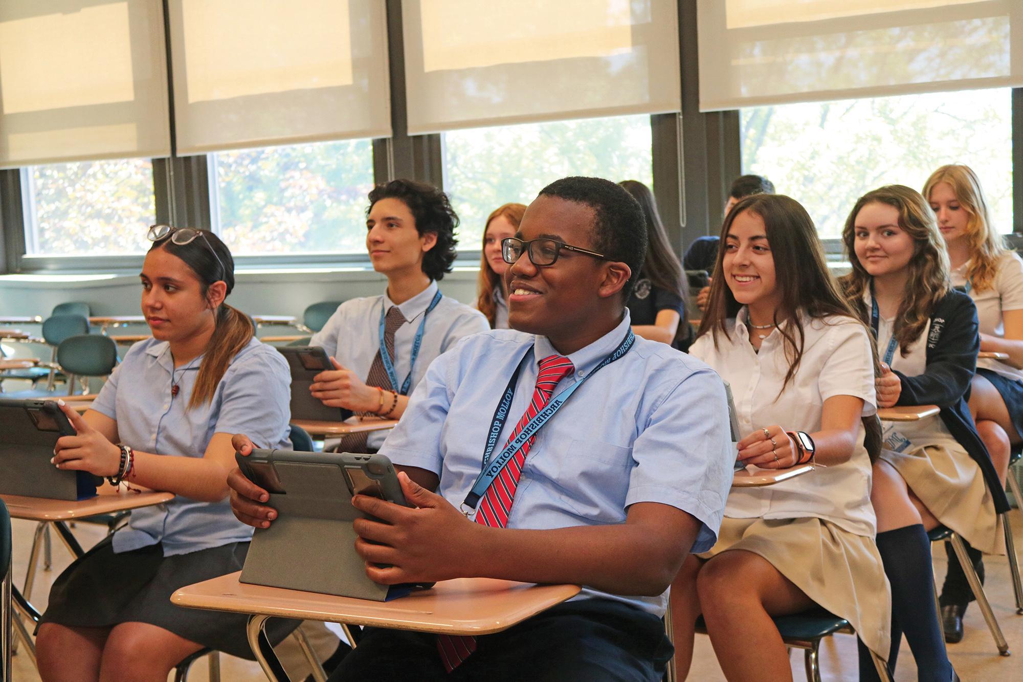 Student in class using calculator