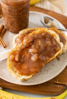 drunken monkey banana rum jam spread on two pieces of toast set on a white plate