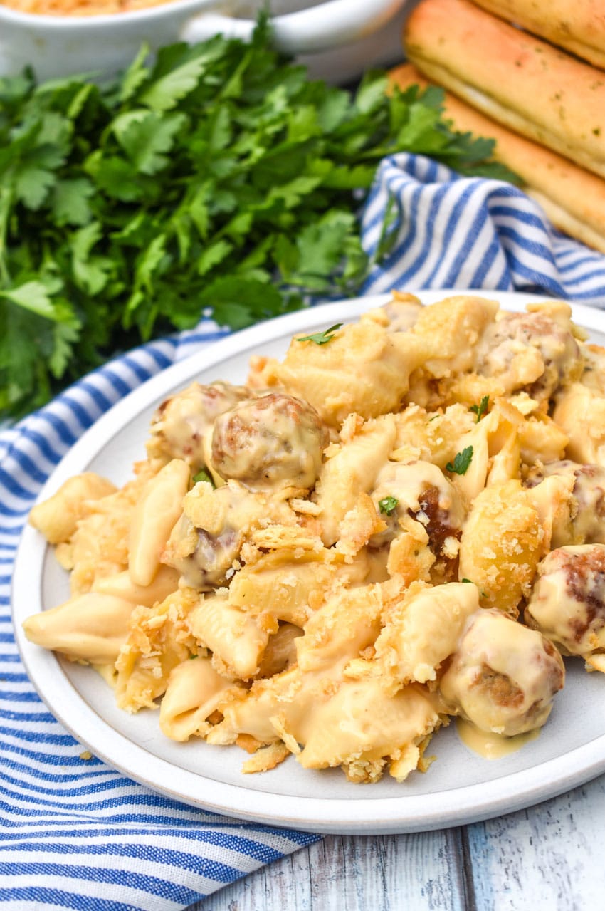 mac and cheese with meatballs on a white plate