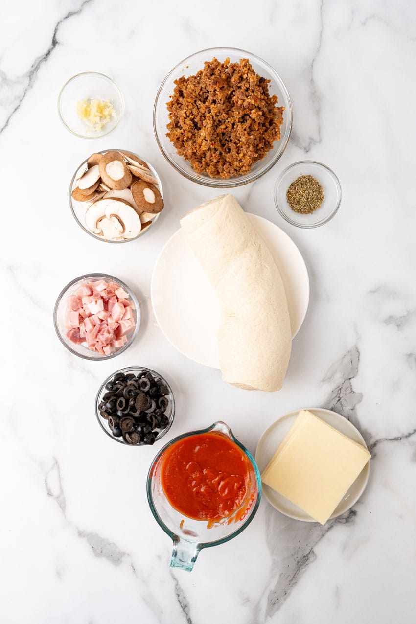 an overhead image showing the measured ingredients needed to make a batch of pizza pot pie