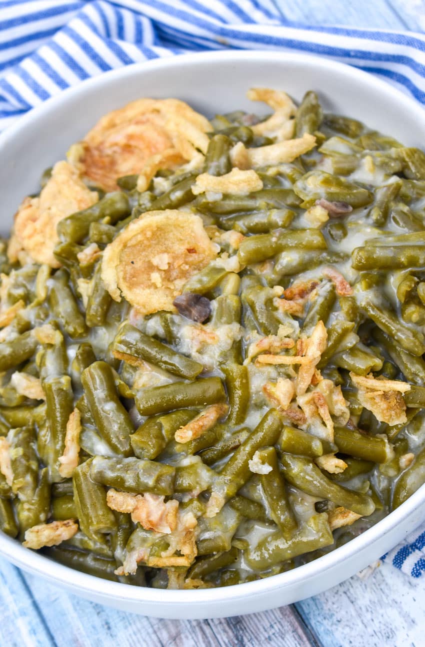 smoked green bean casserole in a shallow white serving bowl