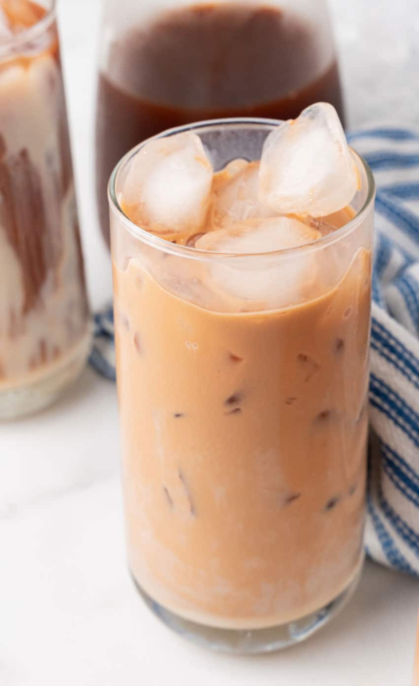 thai iced tea in a large glass with ice cubes