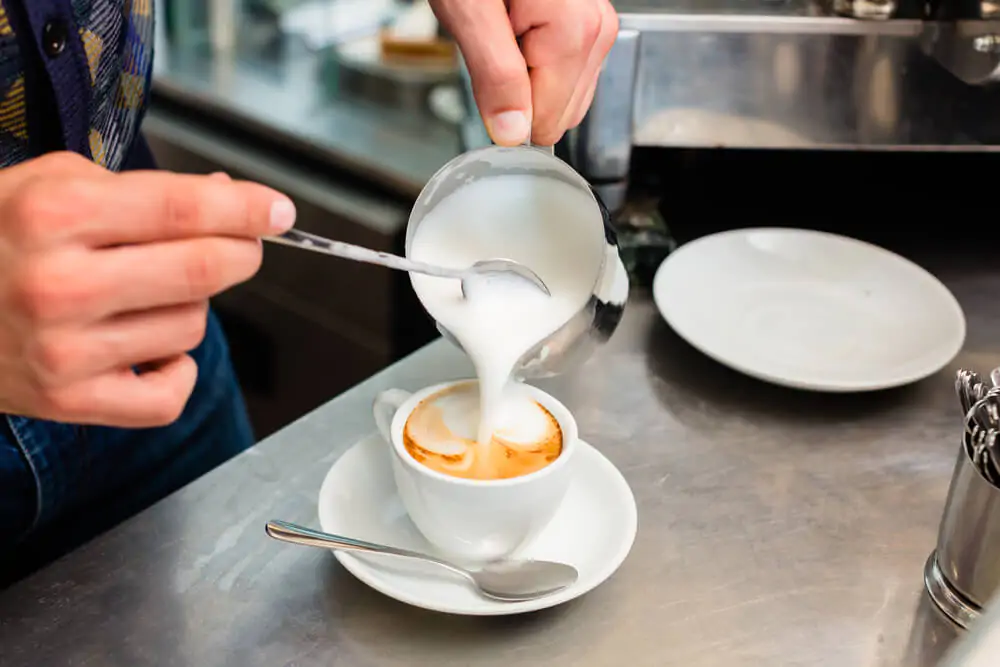 Does milk make coffee less acidic? 