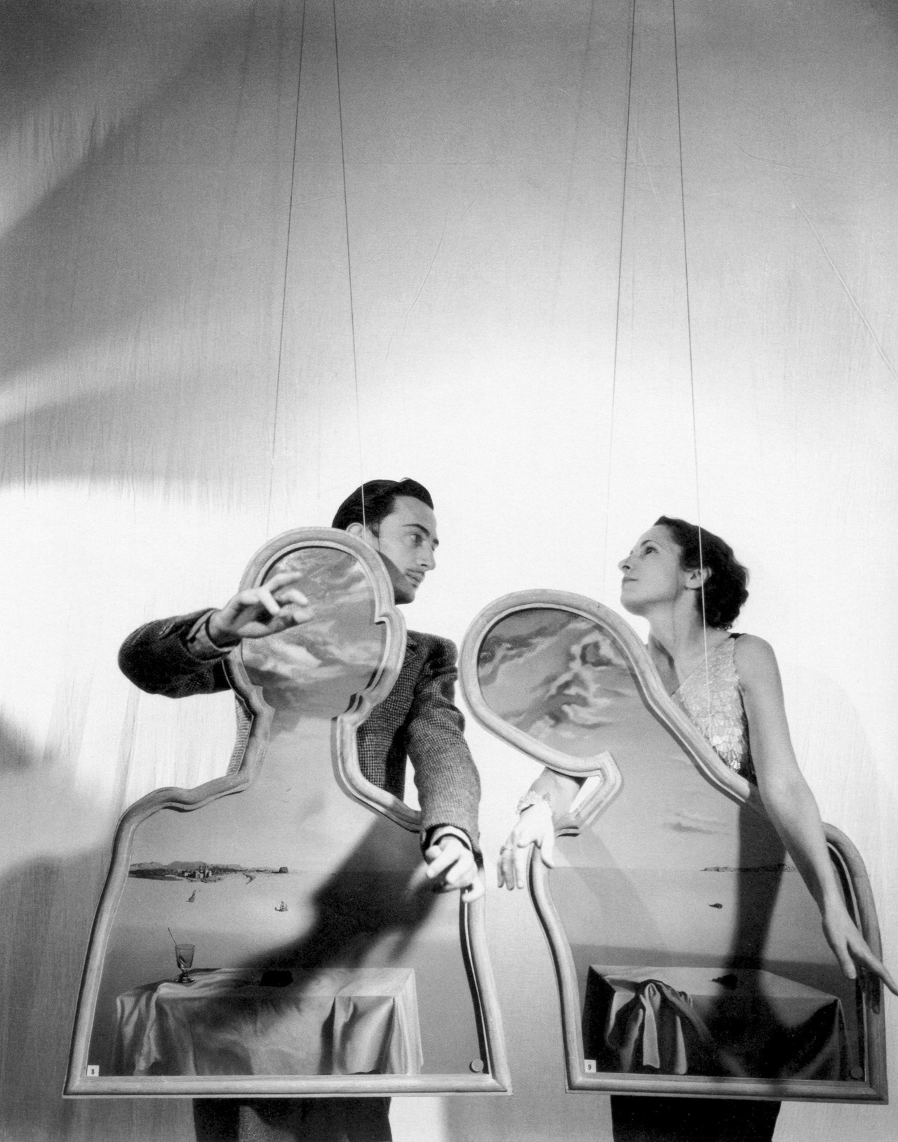 ladybegood:
“Salvador and Gala Dali photographed by Cecil Beaton with Dali’s Couple with their Heads Full of Clouds, 1936
”