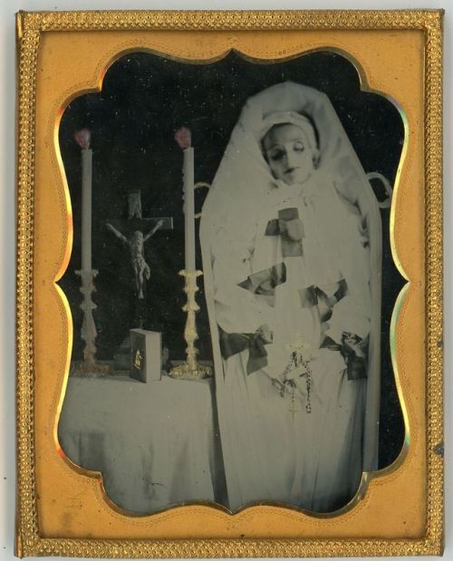 ca. 1880s-1910s, [hand tinted ambrotype, post mortem portrait of a child in a coffin, clutching a rosary and crucifix]