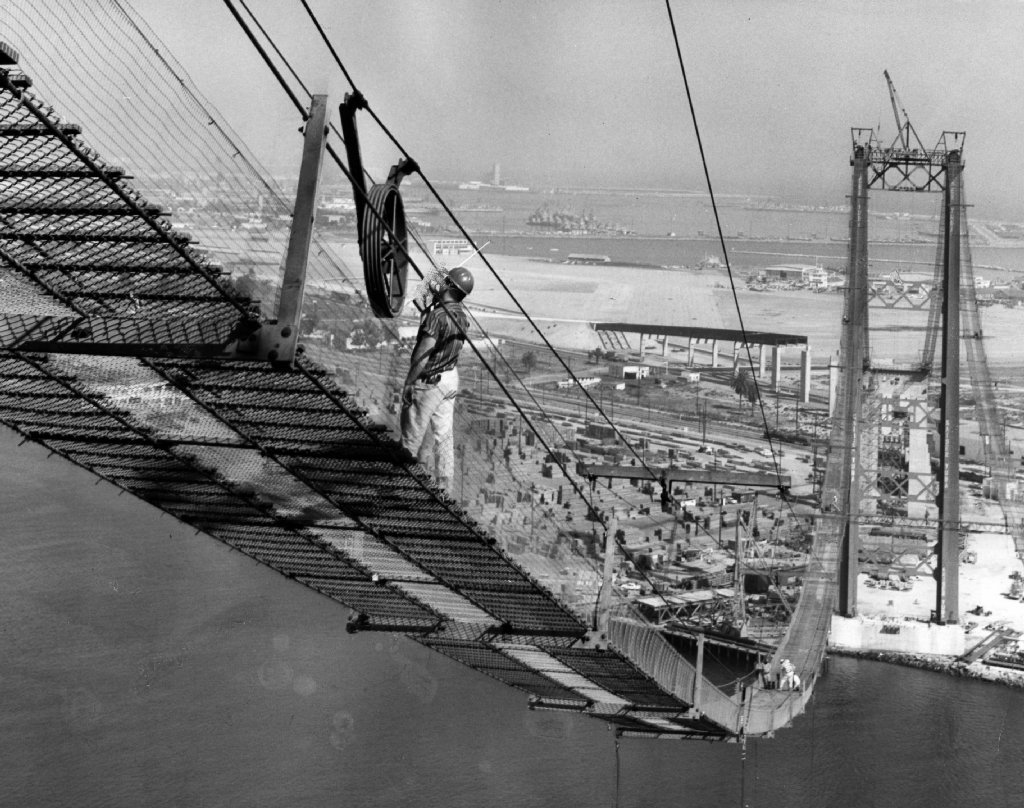 The Vincent Thomas Bridge, connecting San Pedro and Long Beach, opened 50 years ago today. Scott Harrison at Framework has the story: Vincent Thomas Bridge turns 50
Photos: (Top) With catwalks in place, workers begin spinning cables for the 1,500...