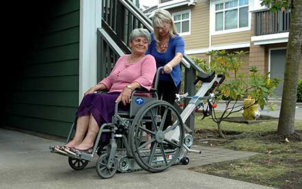 Senior in a wheelchair makes her way onto the Stair-Trac