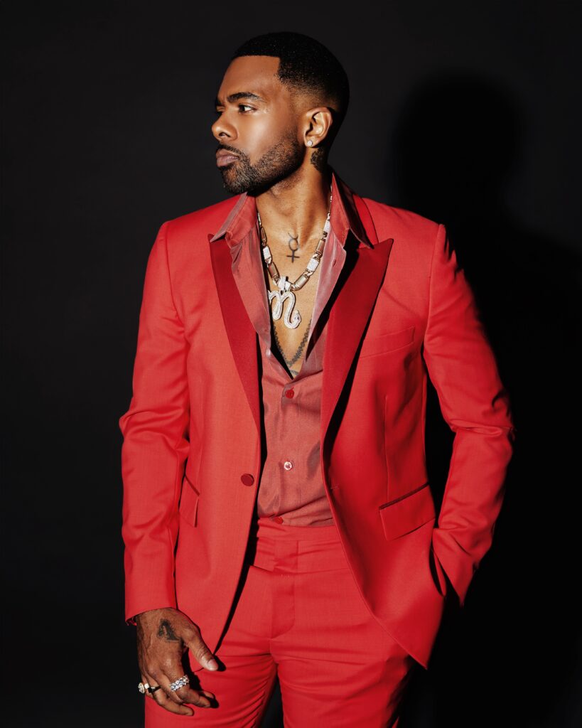 A photo of R&B singer Mario wearing a red out