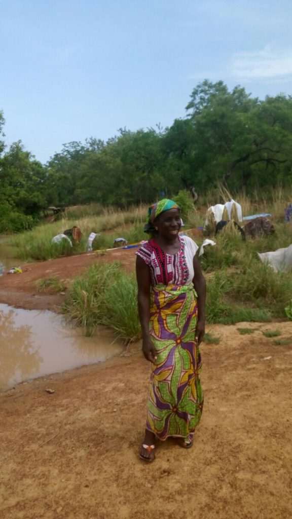 "Today I met up with Nma Nimpaga at Komlanyili at their dugout. She was happy they now have water at their dugout so they don't have to move the center back and forth"