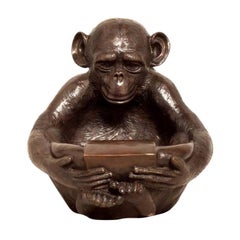 Bronze Sculpture of a Sitting Monkey Holding a Bowl