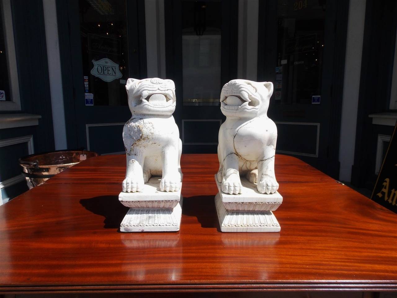 Chinese Export Pair of Chinese Carved Stone Foo Dogs on Rectangular Plinths, 20th Century For Sale