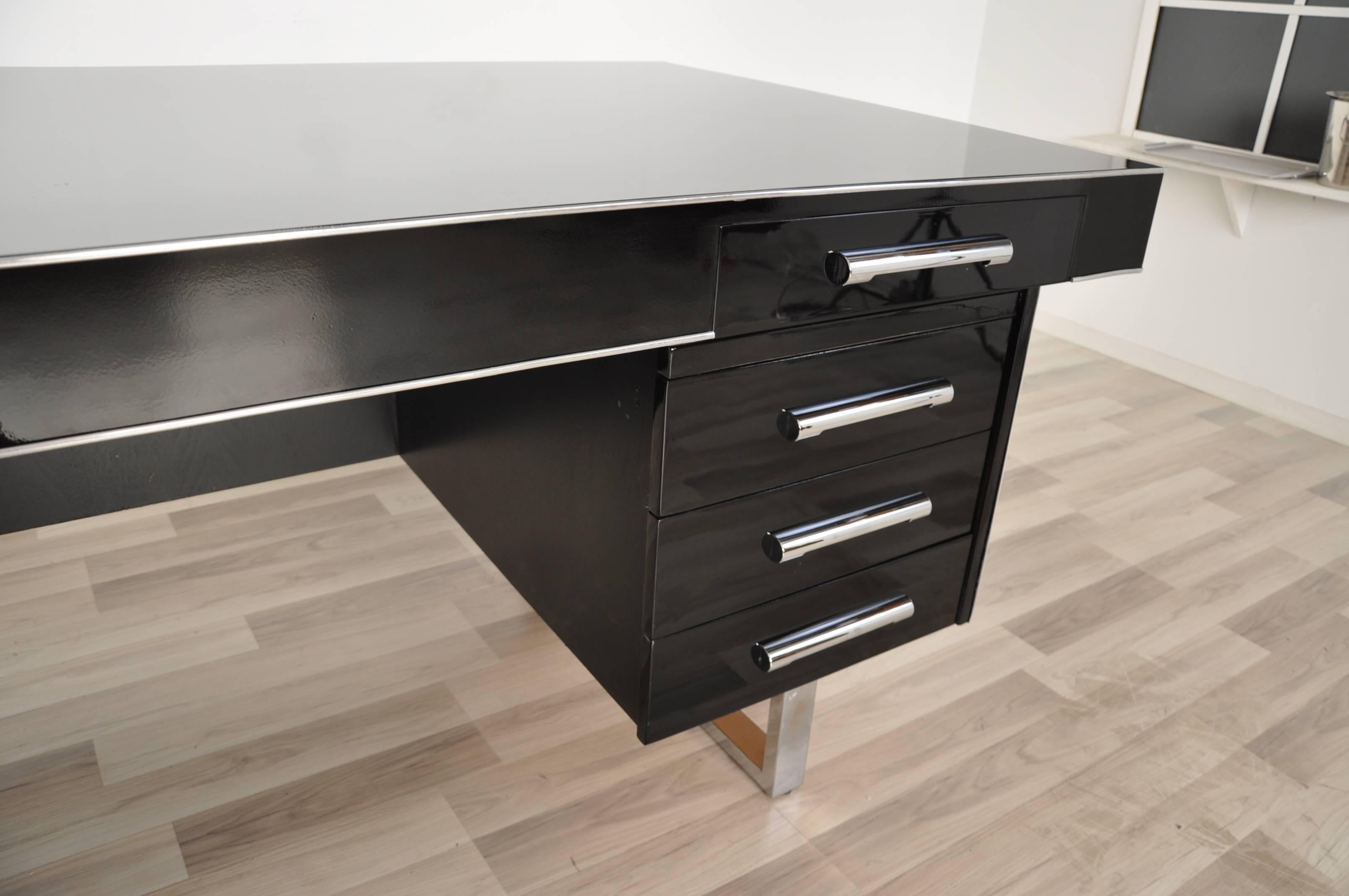 Bauhaus corner desk. Simple body language und straight lines determine the design of this great piece of furniture!

 Wonderful straight body.
 Black high gloss lacquer.
 Chrome lines.
 Plenty of storage space.
 Unique design.