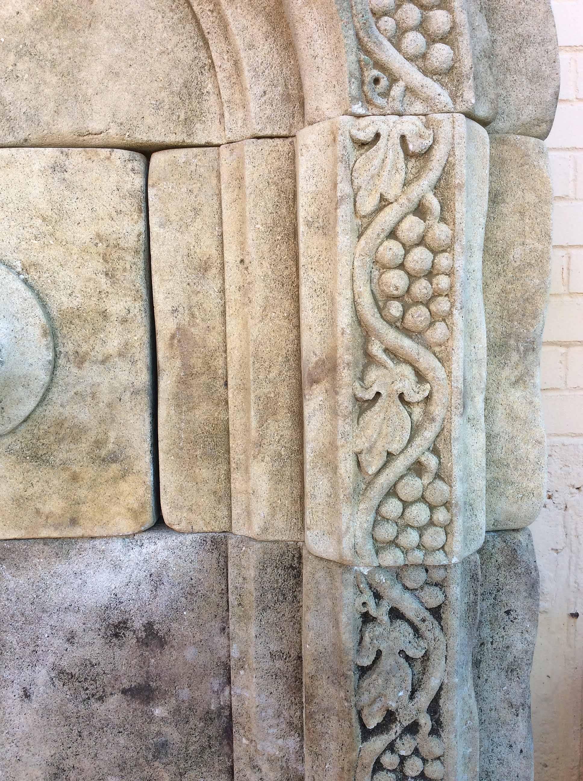 Limestone wall fountain with decorative spout and outstanding grape embellishments hand carved around the border. 

Origin: France 

Early 21st century

 Measurements: 46 1/2