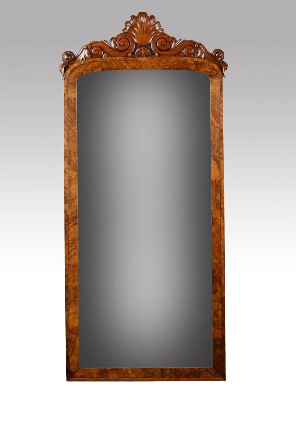 Victorian wall mirror the original mirror plate inset in figured walnut frame.

Dimensions

Height 65.5 inches.

Width 28 inches.

Depth 2.5 inches.