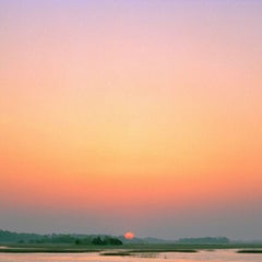 Folly Beach - beautiful sunset with water and trees in orange and red colours