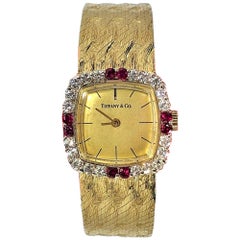 Tiffany & Co. Cushion Shaped Diamond and Ruby Bezel Watch in Yellow Gold