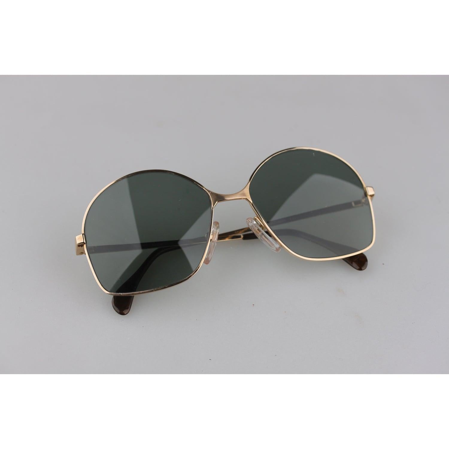 Mint, Squared shaped Vintage Sunglasses by Bausch & Lomb. Made in West Germany. Light gold color, Gold Filled Frame. Model: 516- 54/16 - 130 mm. Condition A+ - MINT Never Worn or Used. NEW Tempered Glass Lenses. Come with a Generic Case. Details