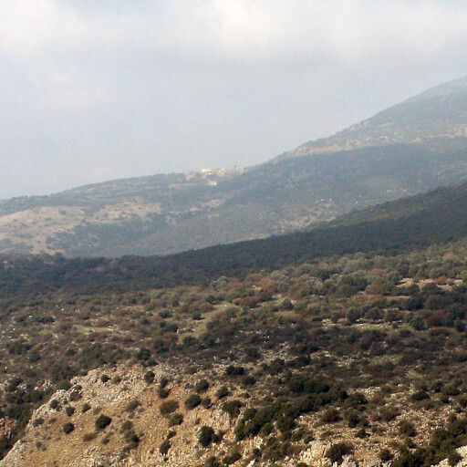 panorama of mountains including Khirbet Mezara in the cloud shadow at center