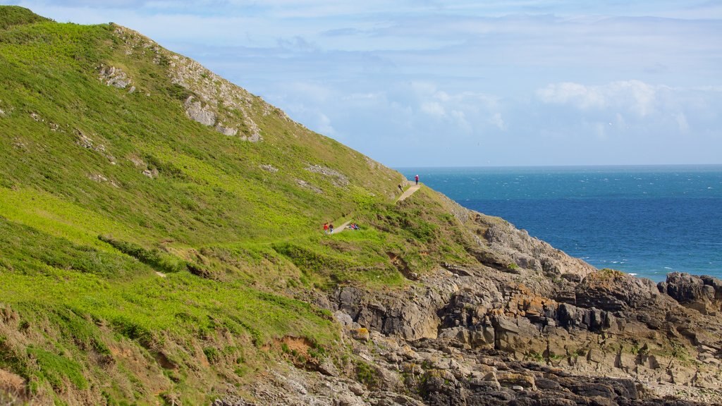 Caswell Bay Beach featuring mountains and general coastal views