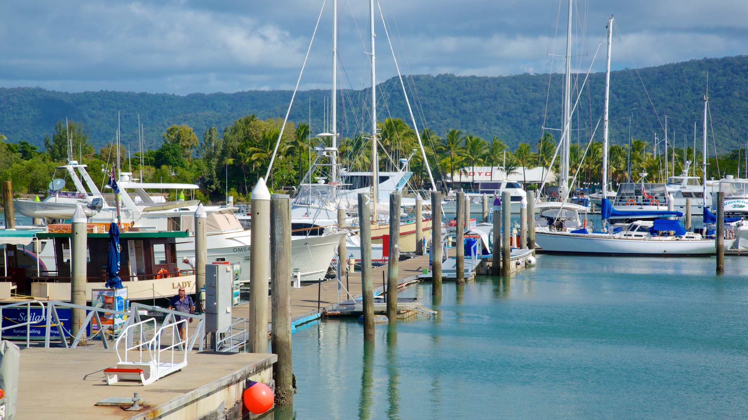 Marina Mirage which includes a coastal town, a marina and boating