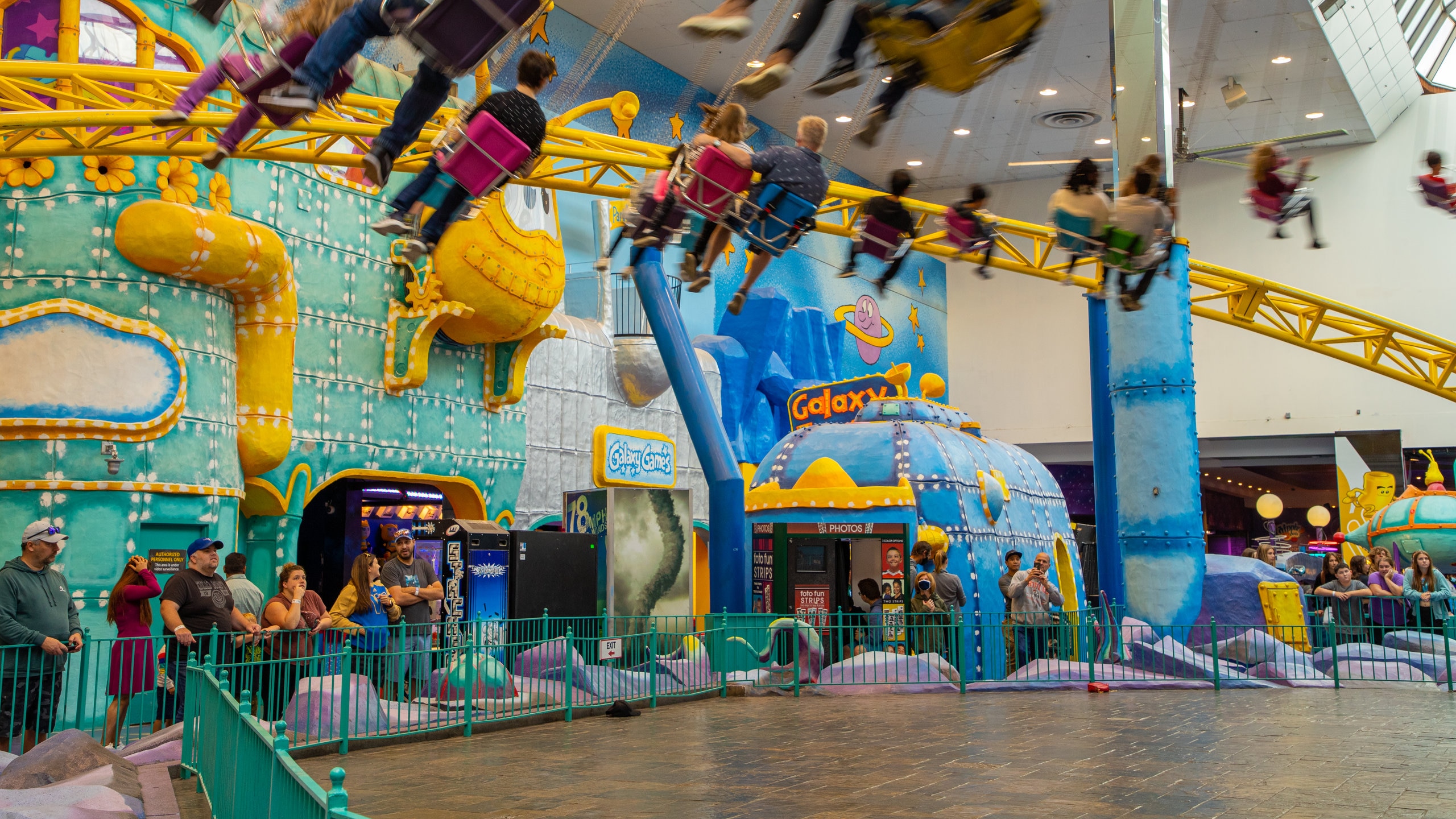 West Edmonton Mall which includes rides and interior views as well as a small group of people