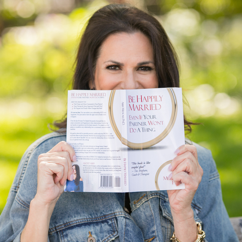 Dr. Abby with her Book "Be Happily Married, Even If Your Partner Won't Do A Thing"