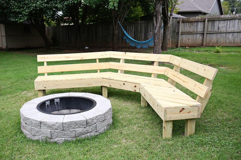 a built bench around a fire pit