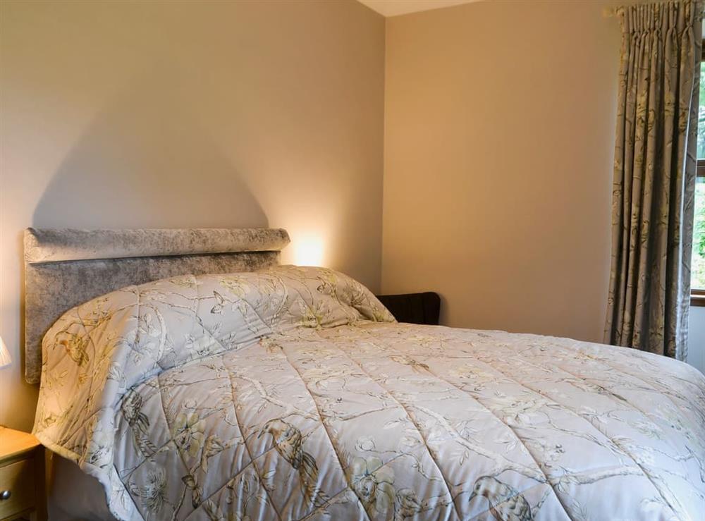 Bedroom with kingsize bed at Perch Hall Cottage in Johnston Bridge, near Lockerbie, Dumfries and Galloway, Dumfriesshire