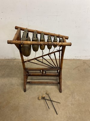 Lot 94 - A bamboo framed Chinese xylophone striking on...