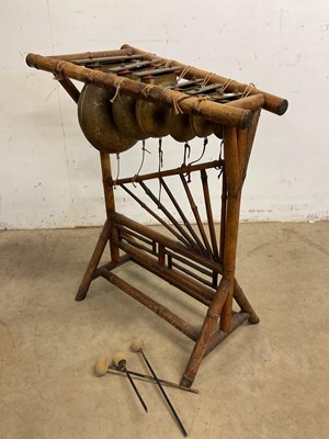 Lot 94 - A bamboo framed Chinese xylophone striking on...