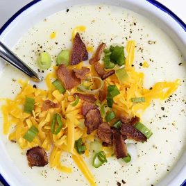 Loaded Baked Potato Soup Recipe - Loaded baked potato soup makes a warm, comforting potato soup recipe. Made with baked potatoes blended into a creamy soup and topped with your potato bar favorites! // addapinch.com