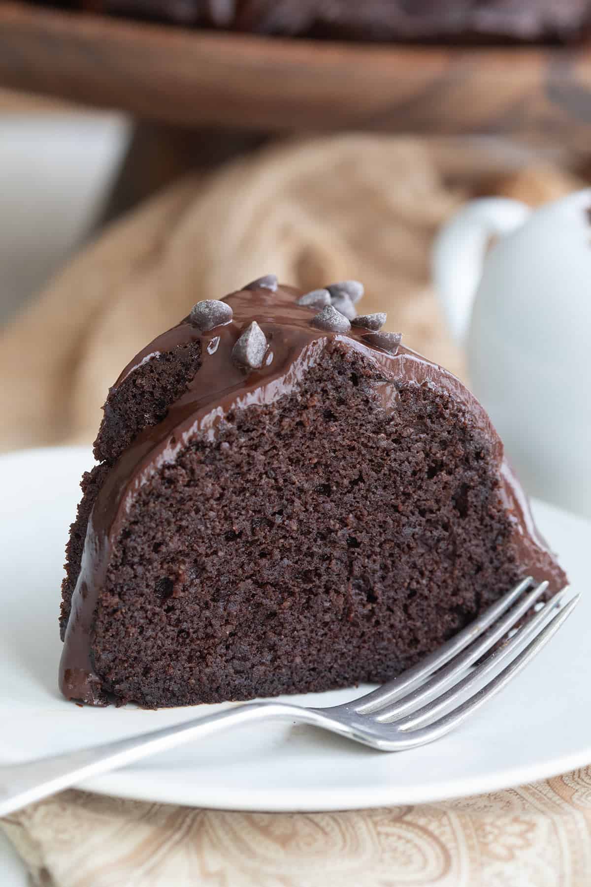 Close up shot of Keto Chocolate Ricotta Cake on a white plate.