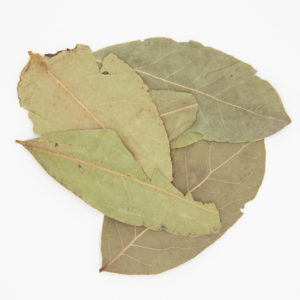 5 Whole Basil Leaves Dried For Cooking On A White Background