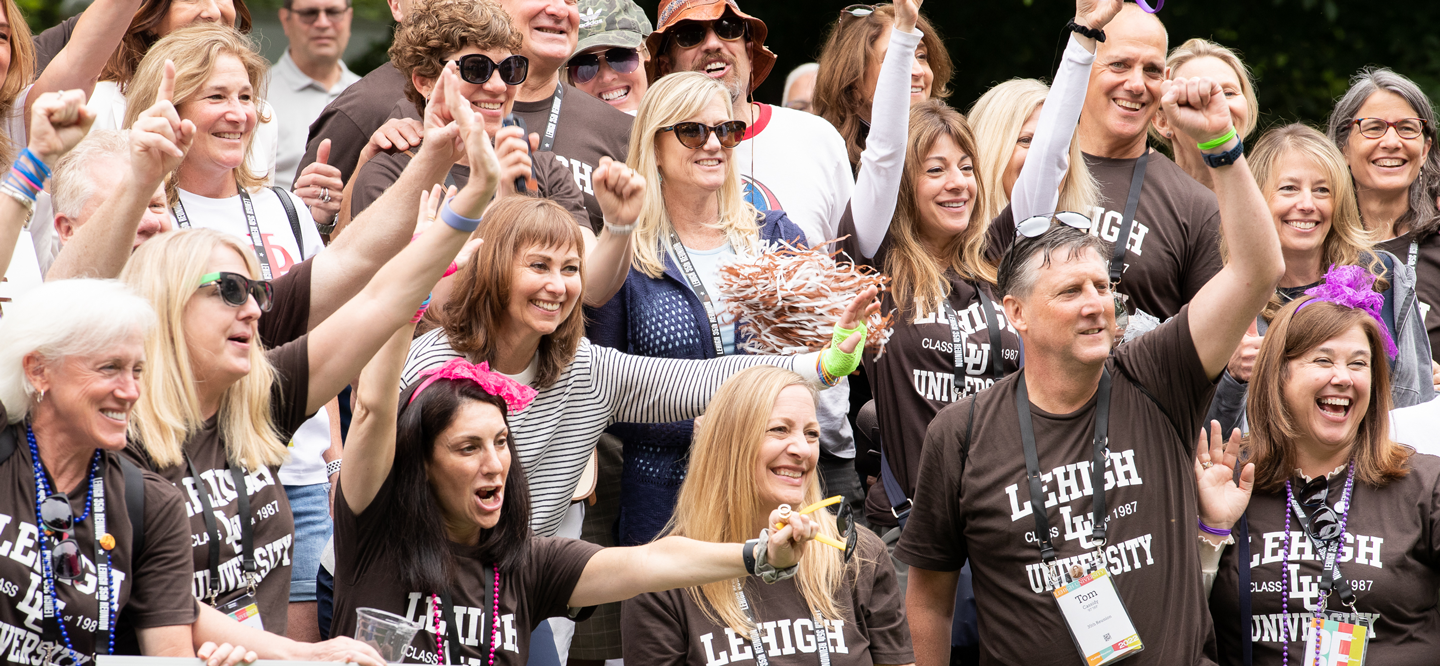 Alumni cheering and wearing Lehigh gear