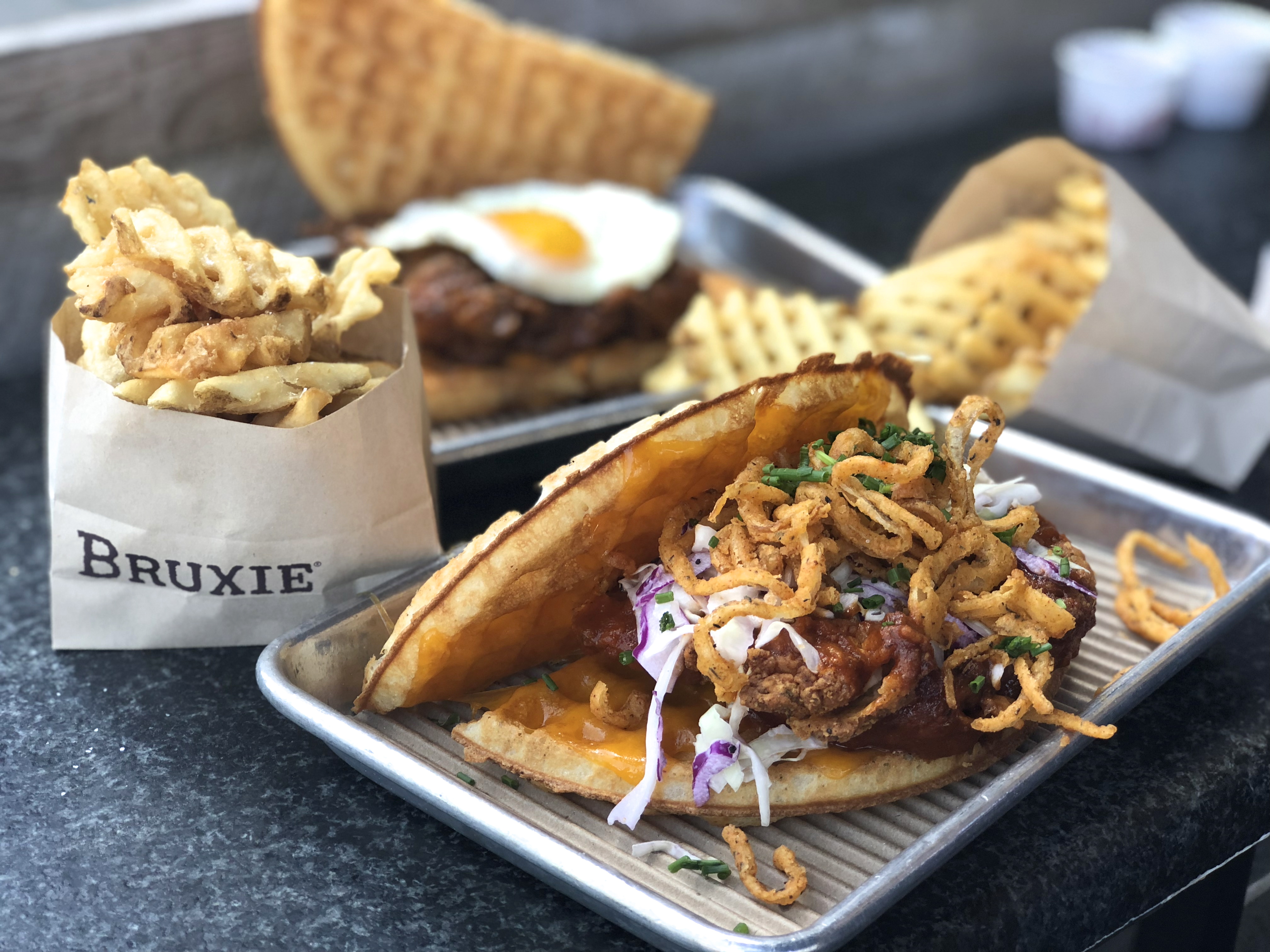 Bruxie chicken and waffle sandwiches with waffle fries