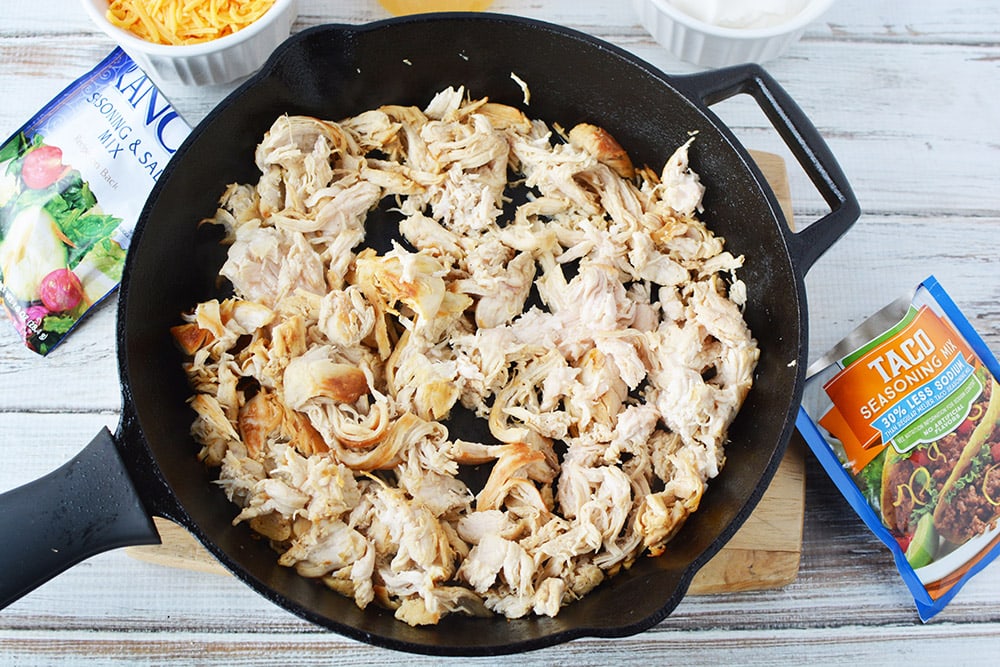 Shredded chicken in a skillet.