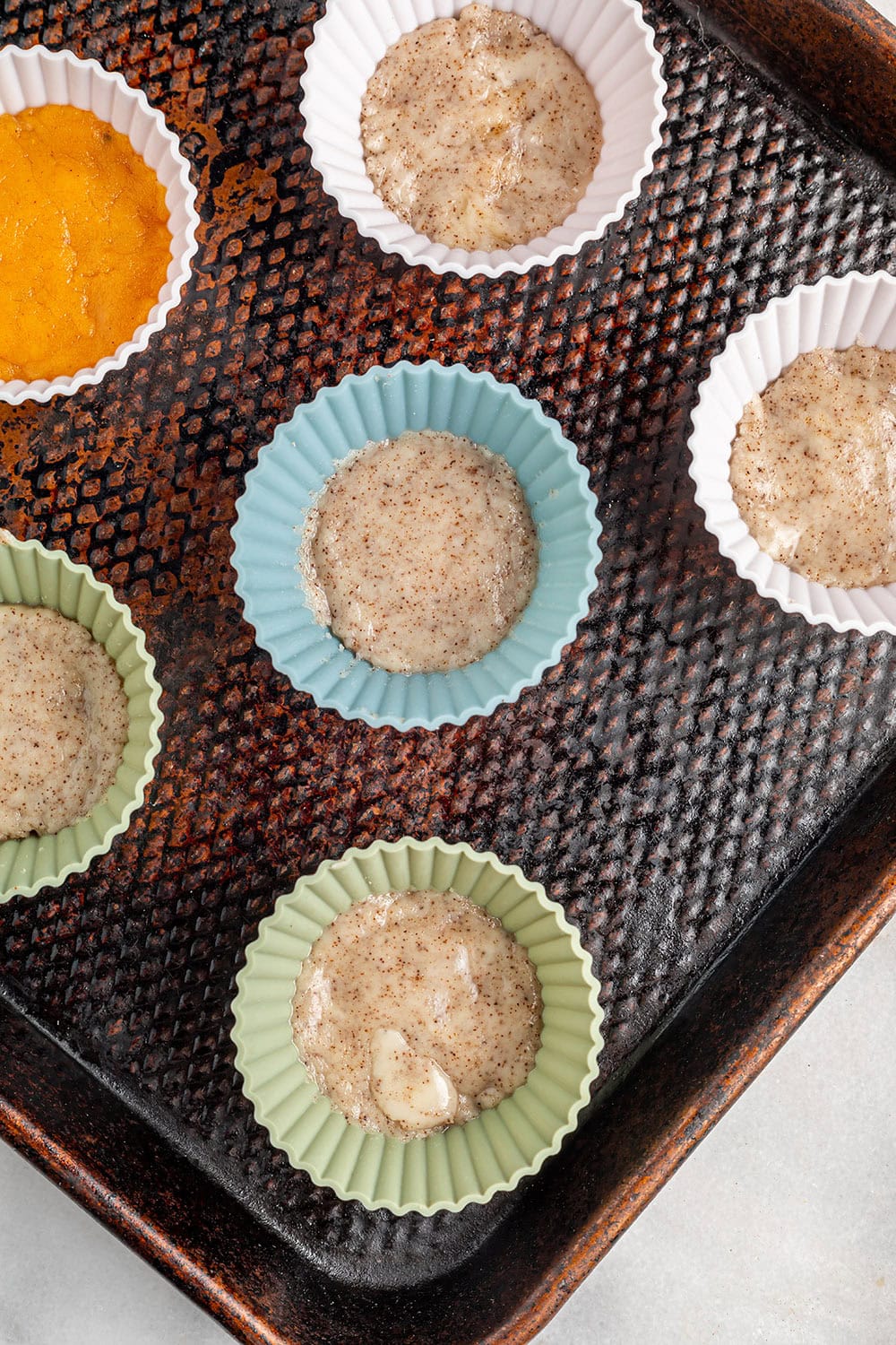 Coffee mixture in liners in a pan. 