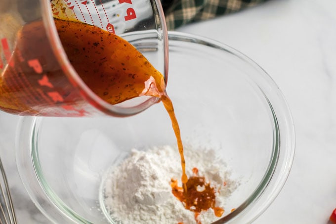 adding broth to cornstarch