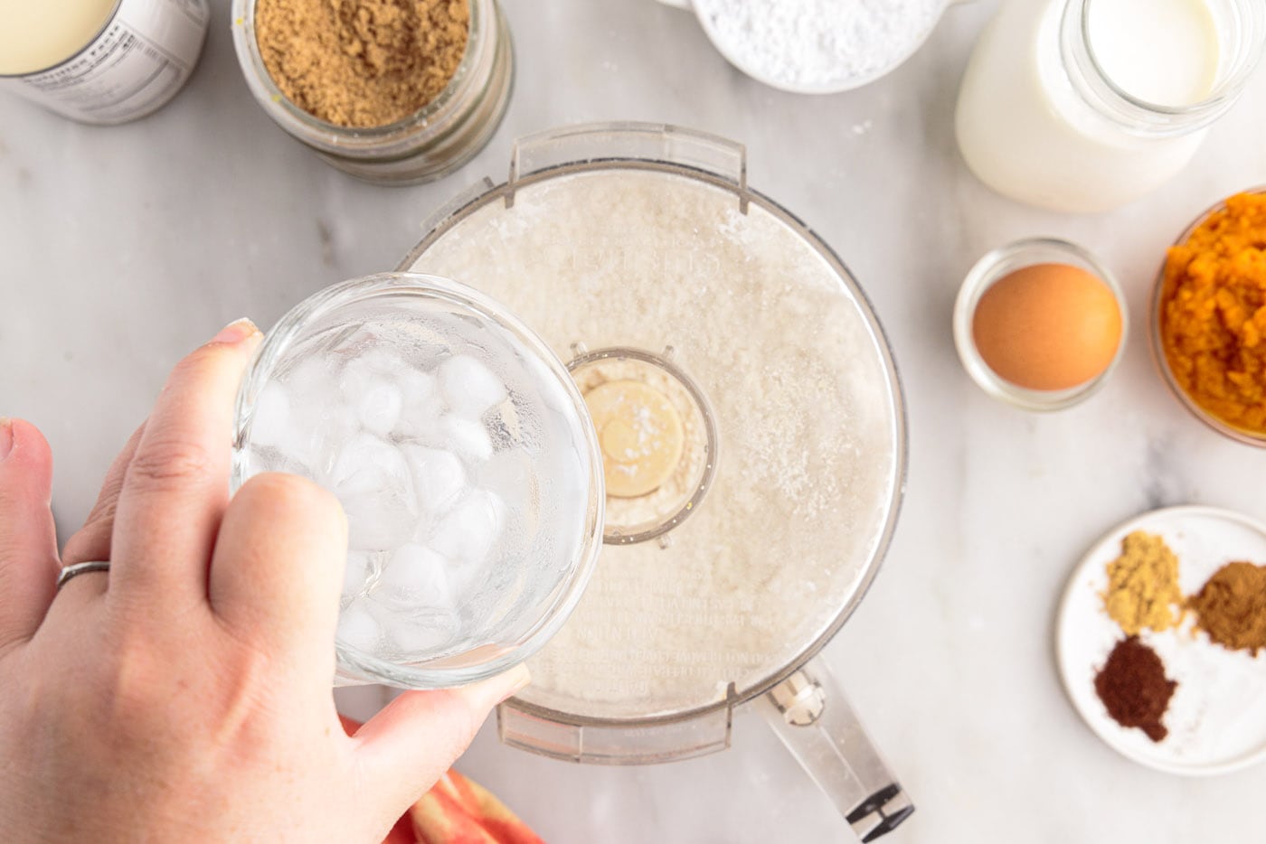 pouring ice water into food processor