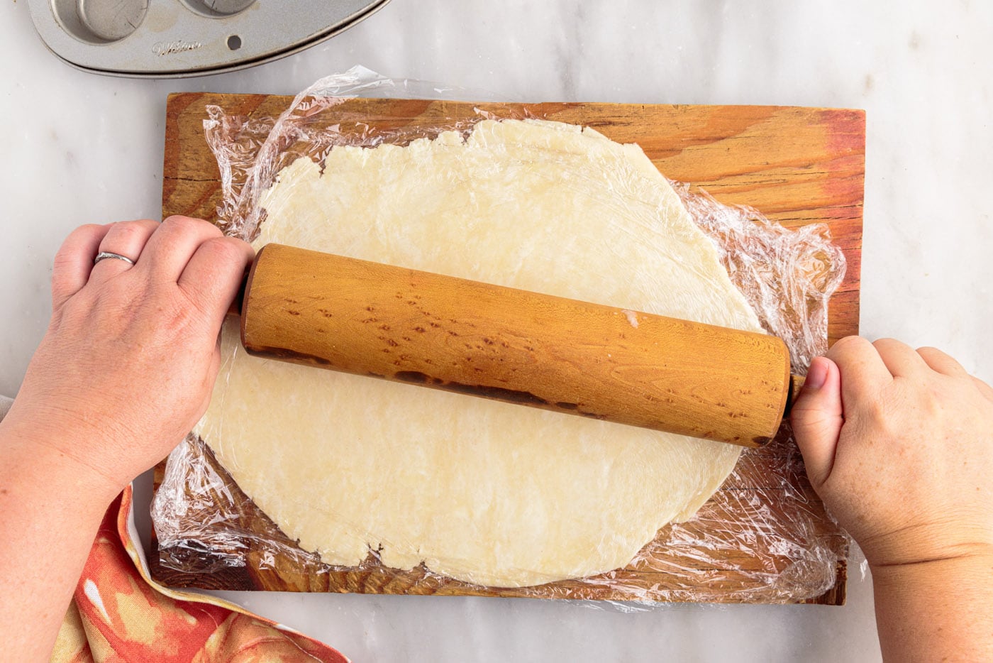 rolling out homemade pie dough