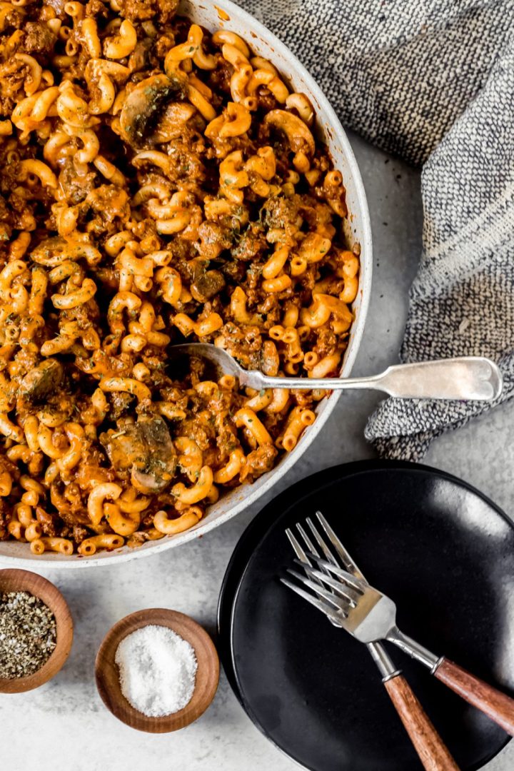 pan of Venison goulash with plate and forks