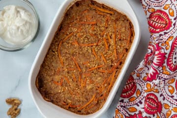 Baked Carrot Cake Oatmeal in white baking dish.