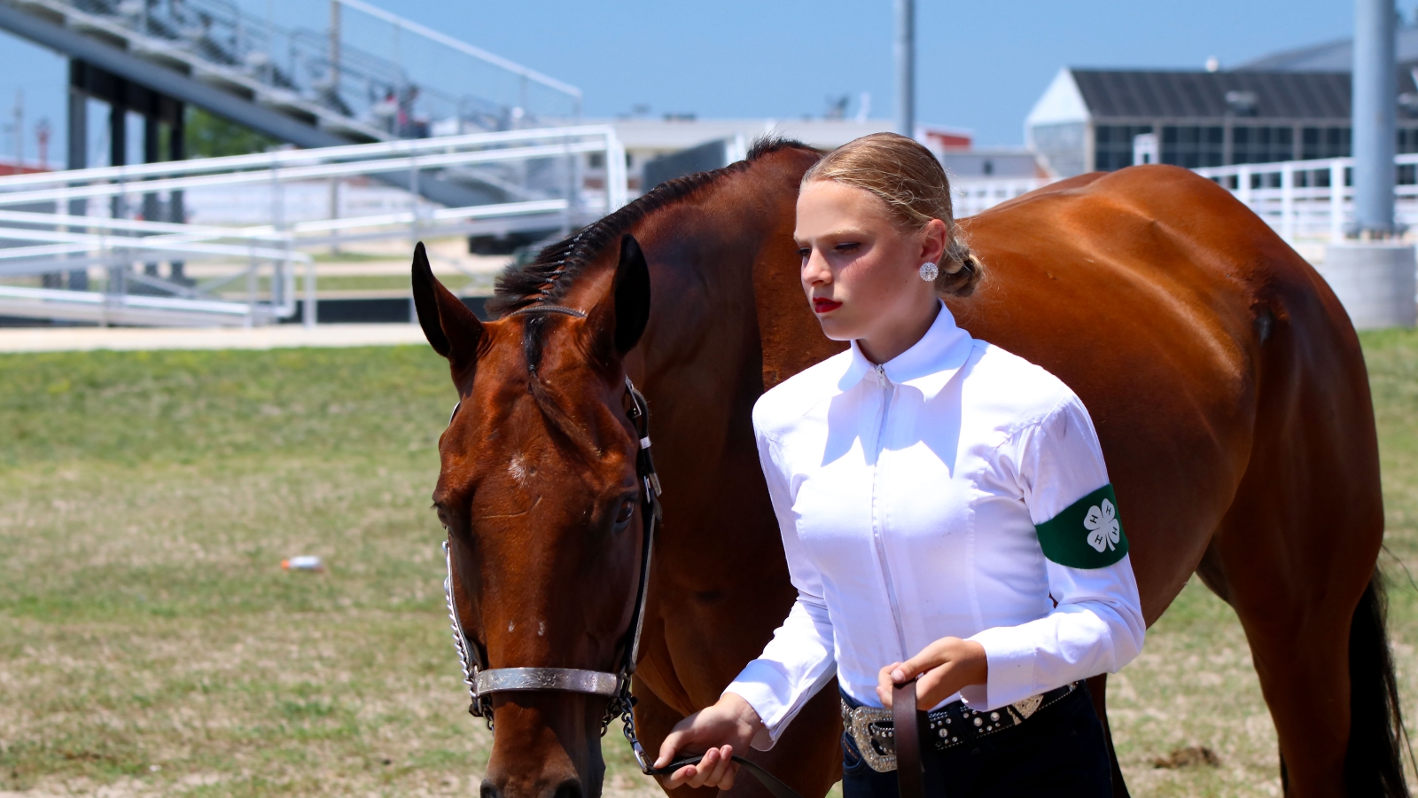 a state horse show participant walking with her horse