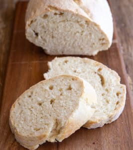 loaf with 2 slices on a wooden board