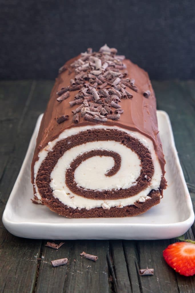 Swiss Roll cake on a white plate.