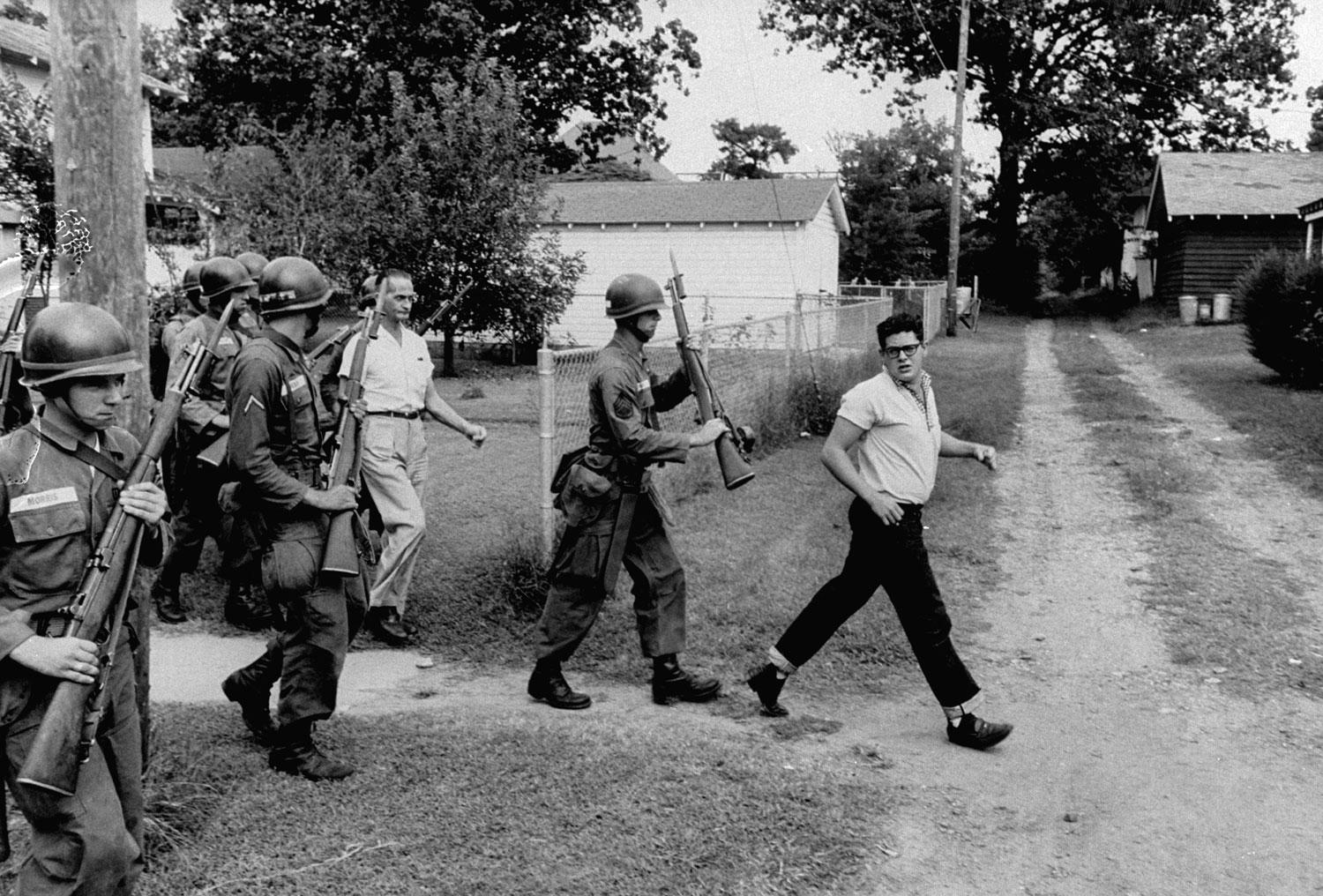 Segregationists rousted from an anti-integration protest, Little Rock, Arkansas, 1957.